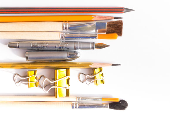 Assorted Pencils Pens and Brushes: A Creative Toolkit